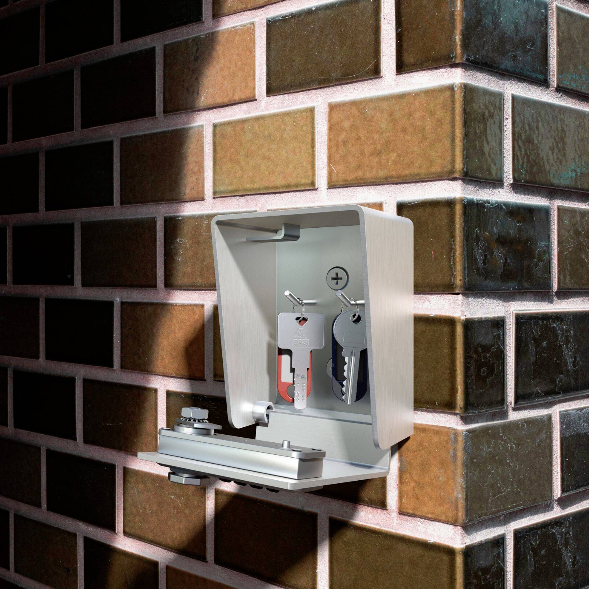 Ein Schlüsselkasten an einer Ziegelwand enthält zwei Schlüssel. Der Kasten ist offen und zeigt den Mechanismus zur Befestigung.