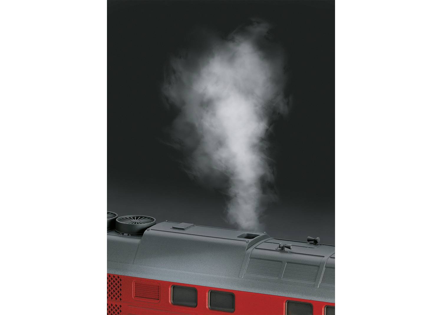 Roter Zug mit Dampfausstoß aus dem Dach, vor schwarzem Hintergrund.