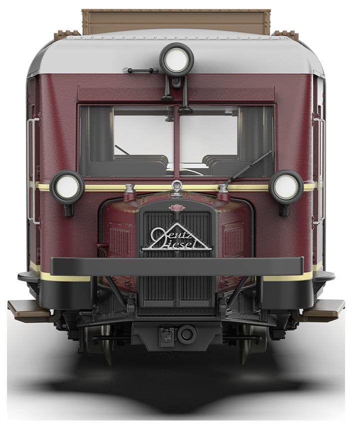 Ein historischer roter Schienenbus mit der Aufschrift 'Diesel' auf der Front. Retro-Design mit großen Scheinwerfern und einer rechteckigen Form.