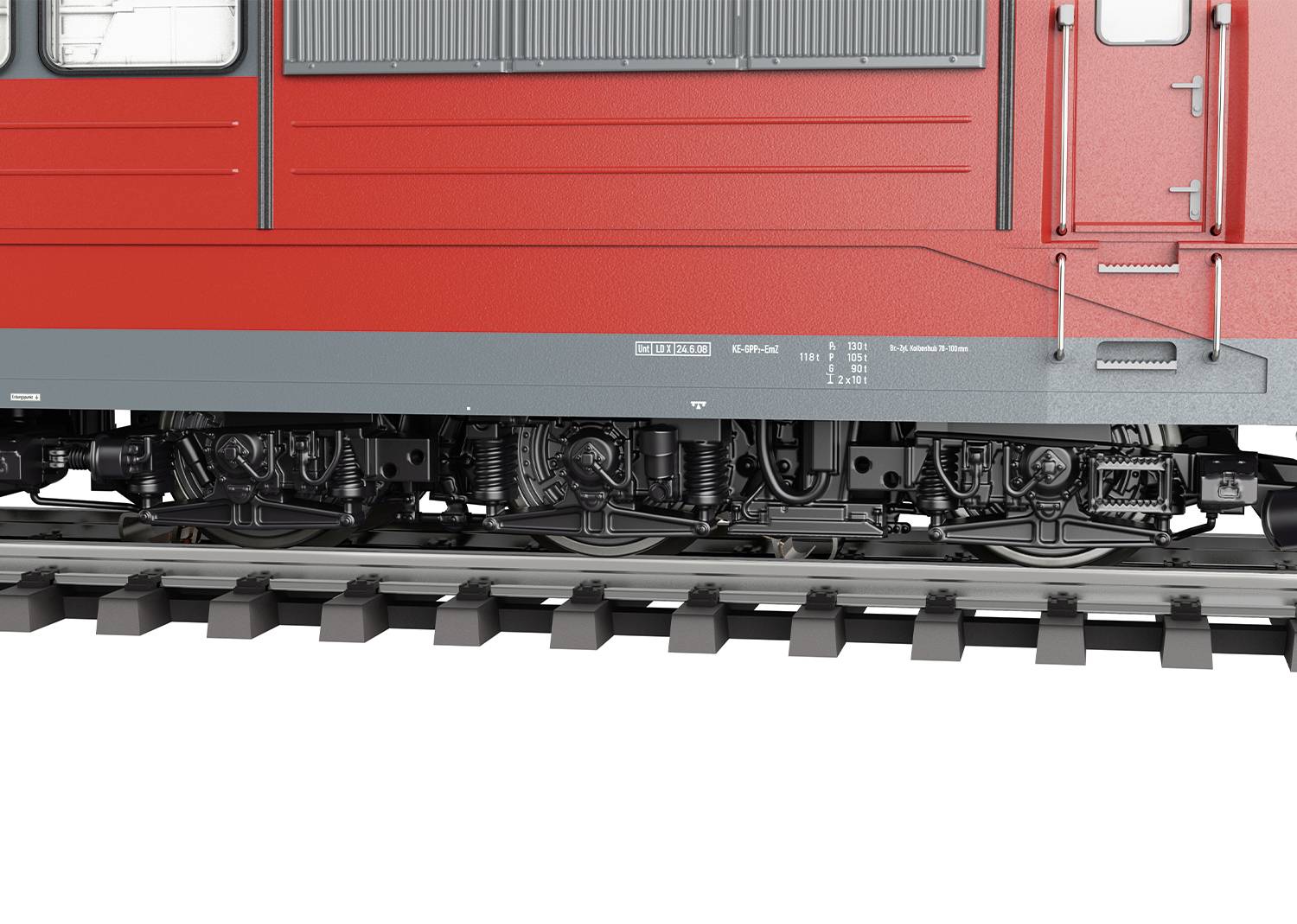 Ein roter Zug auf Gleisen, Nahaufnahme des Fahrwerks. Sichtbar sind Details der Federung und Räder. Keine Menschen oder Landschaft.