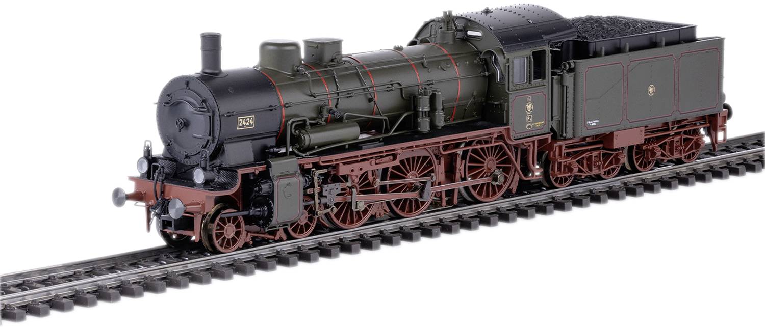Ein Modell einer historischen Dampflokomotive auf einem Gleis, dunkelgrün mit roten Details, zeigt die Detailtreue der Bauweise.