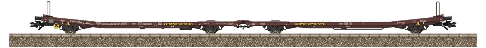 Ein leeres, langes Eisenbahnflachwagen auf Gleisen, genutzt für den Transport von großen oder sperrigen Gütern.