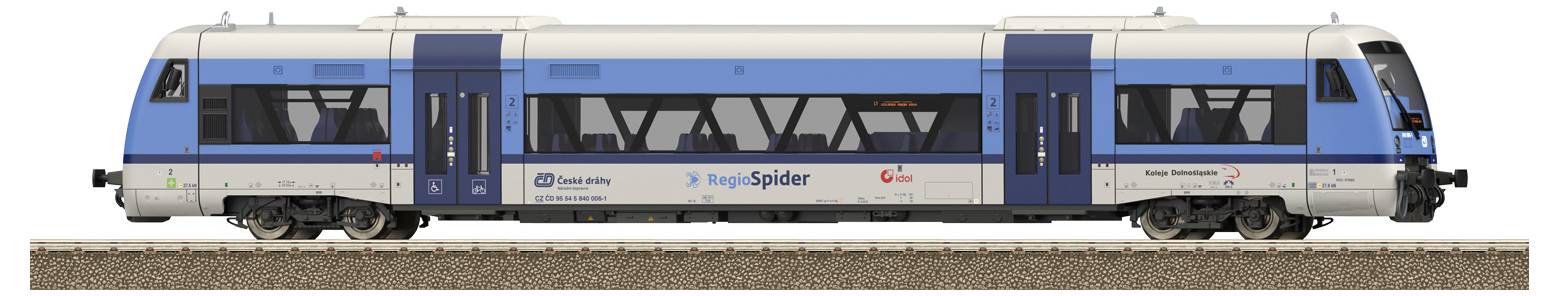 Ein moderner blauer Zug steht auf den Gleisen. Die Türen sind geschlossen. Der Himmel spiegelt sich in den Fenstern.