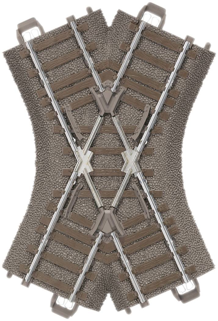 Kreuzung eines Spielzeug-Eisenbahngleises mit vier Geleisen auf einem realistisch aussehenden, kiesartigen Gleisbett.