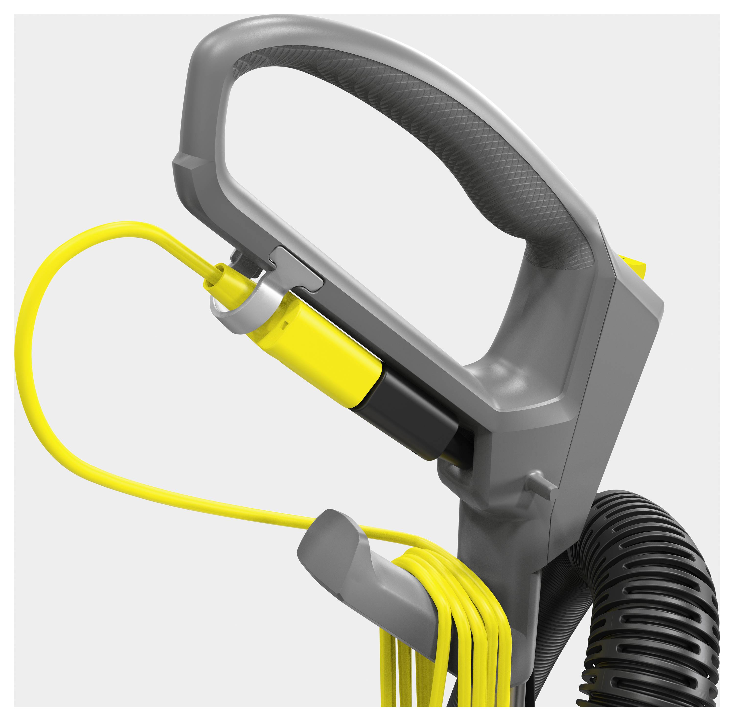 Ein grauer Griff eines Haushaltsgeräts mit einem gelben Knopf und gelbem Kabel, das aufgerollt ist.