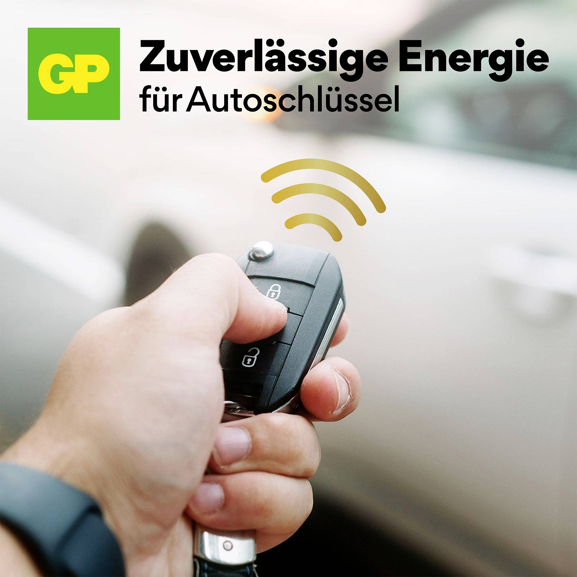 Hand hält Autoschlüssel; Hintergrund unscharf. Text: 'Zuverlässige Energie für Autoschlüssel'. Symbol für Funksignal.