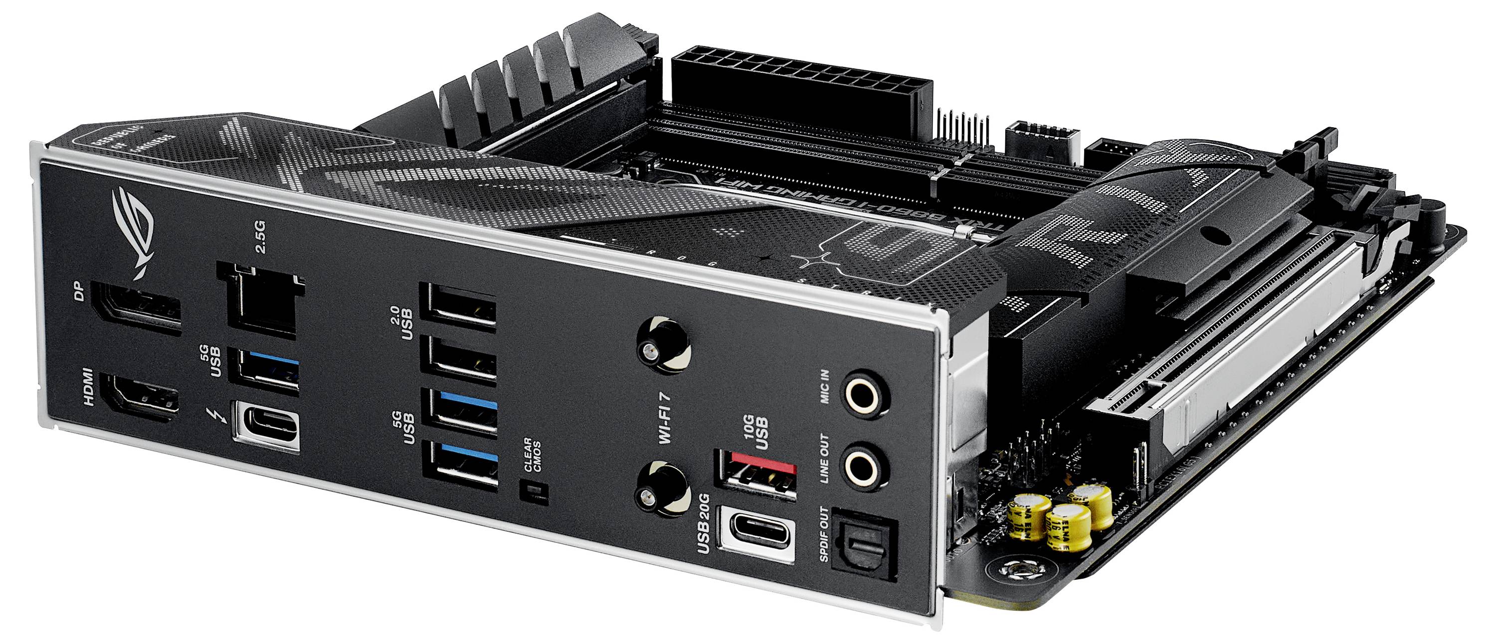 Eine schwarze Computerplatine mit verschiedenen Anschlüssen wie USB, HDMI und Audioeingängen, auf der Kühlkörper sichtbar sind.