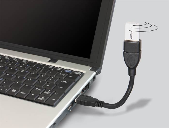 Ein USB-Gerät mit Wireless-Adapter ist an einen Laptop angeschlossen.