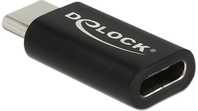 Ein schwarzer USB-C-Adapter der Marke Delock liegt schräg.