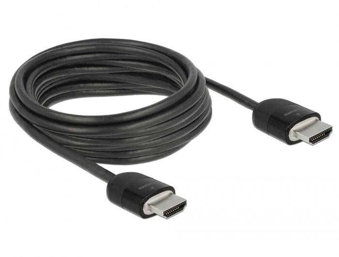 Ein schwarzes HDMI-Kabel, aufgerollt, mit zwei Steckern auf beiden Enden, geeignet für die Verbindung von Audio- und Videogeräten.