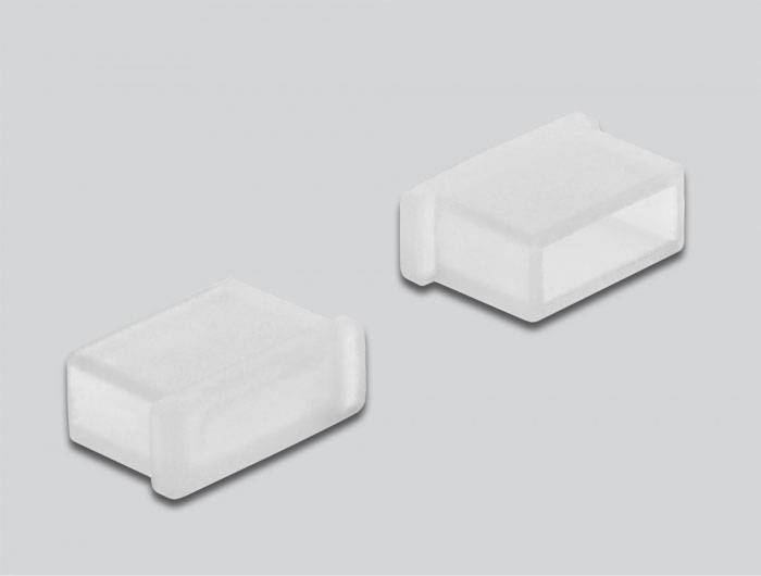 Zwei rechteckige, transparente Plastikabdeckungen nebeneinander auf grauem Hintergrund. Sie sind einfach und funktional gestaltet.