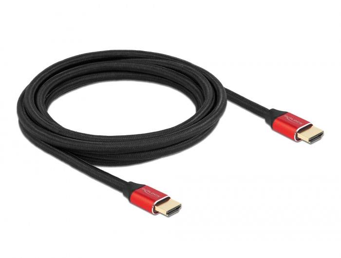 Schwarzes HDMI-Kabel mit roten Anschlüssen, gerollt nebeneinander liegend.