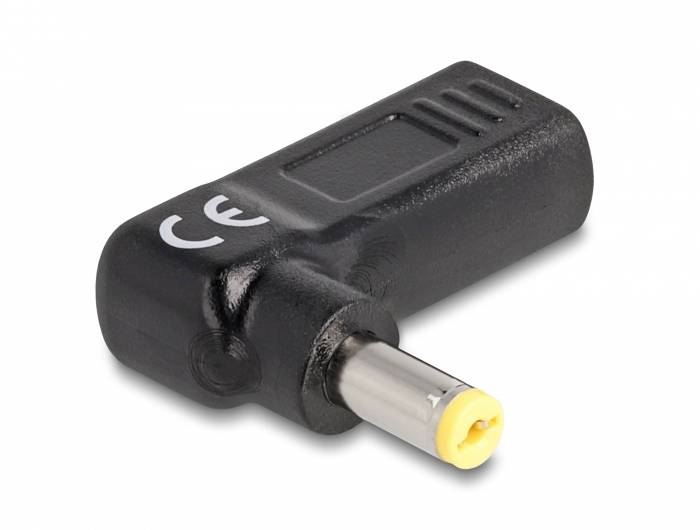 Schwarzer Stromadapter mit gelbem Stecker und seitlicher CE-Kennzeichnung.