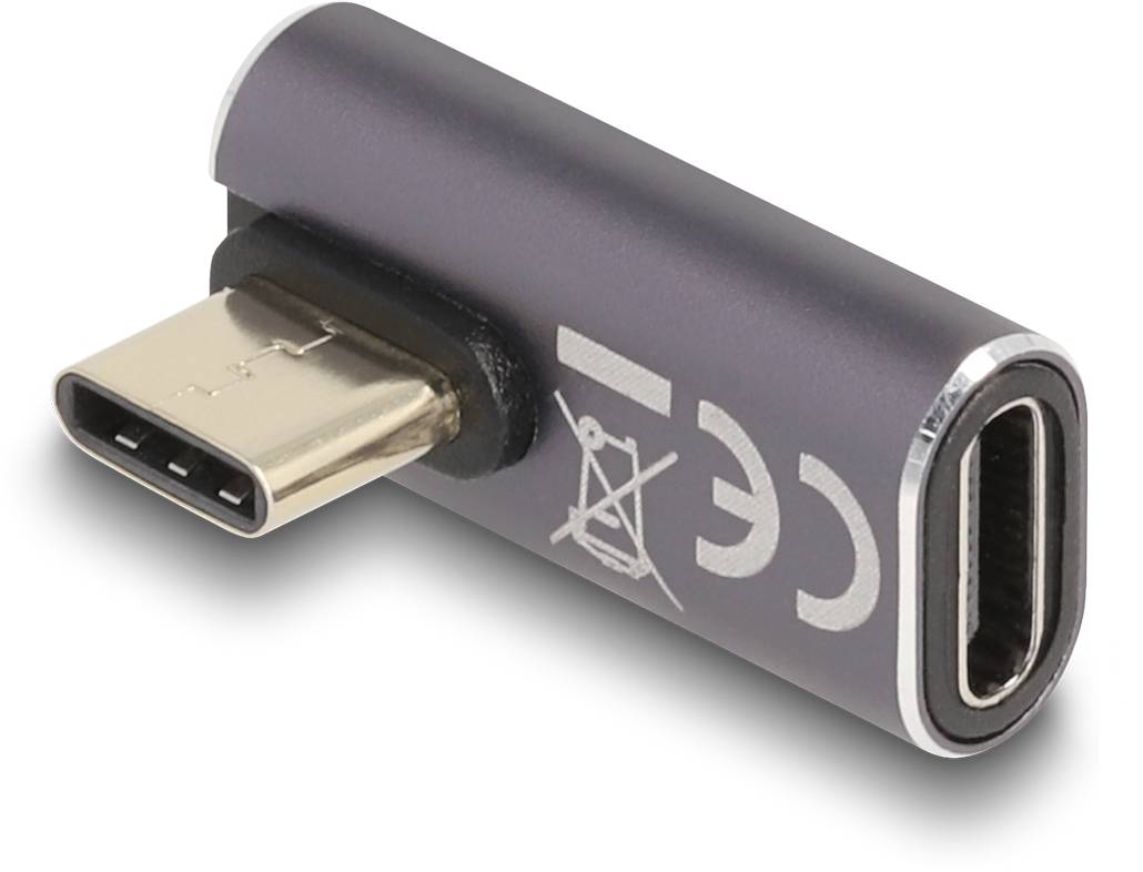 Ein USB-C-Adapter in dunklem Gehäuse, seitlich liegend. Auf einer Seite befindet sich ein männlicher Anschluss, auf der anderen eine weibliche Buchse.