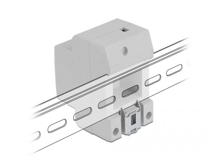 Ein graues elektrisches Bauteil an einer Metallschiene, typisch für den Einsatz in elektrischen Anlagen zur Befestigung von Geräten.