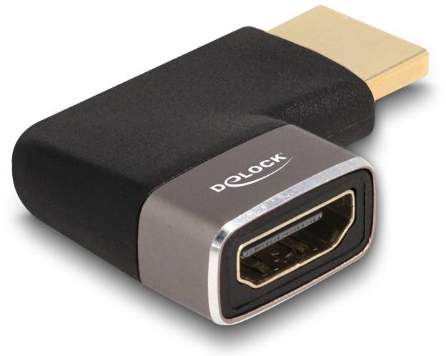 Schwarzer HDMI-Adapter von Delock mit männlichem und weiblichem Anschluss, ermöglicht Verbindung zwischen HDMI-Geräten.