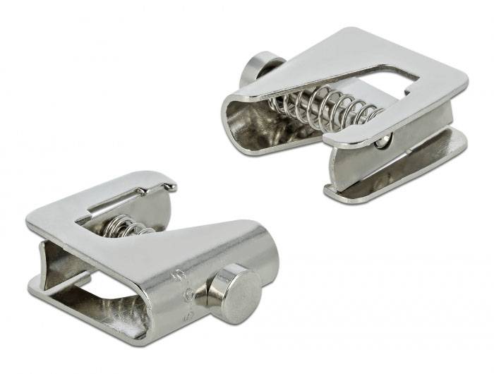 Zwei silberne, metallische Clips mit Federmechanismus auf weißem Hintergrund, genutzt zur Fixierung oder Befestigung von Materialien.