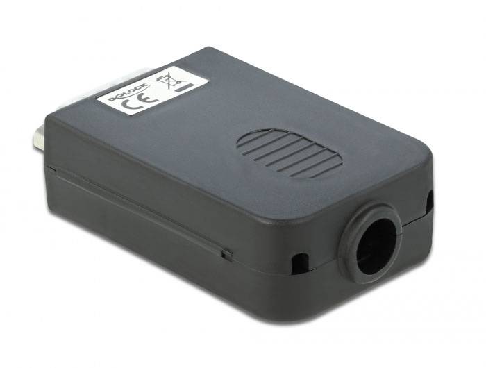 Ein schwarzer Adapter mit abgerundeten Kanten und einem Stecker auf einer Seite. Aufkleber mit CE-Zeichen und Barcode sichtbar.