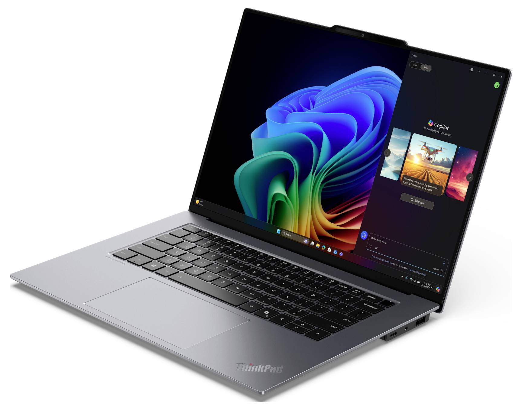 Ein Laptop mit geöffneter Bildschirmansicht zeigt ein farbenfrohes abstraktes Design und die Windows-Oberfläche auf dem Bildschirm.