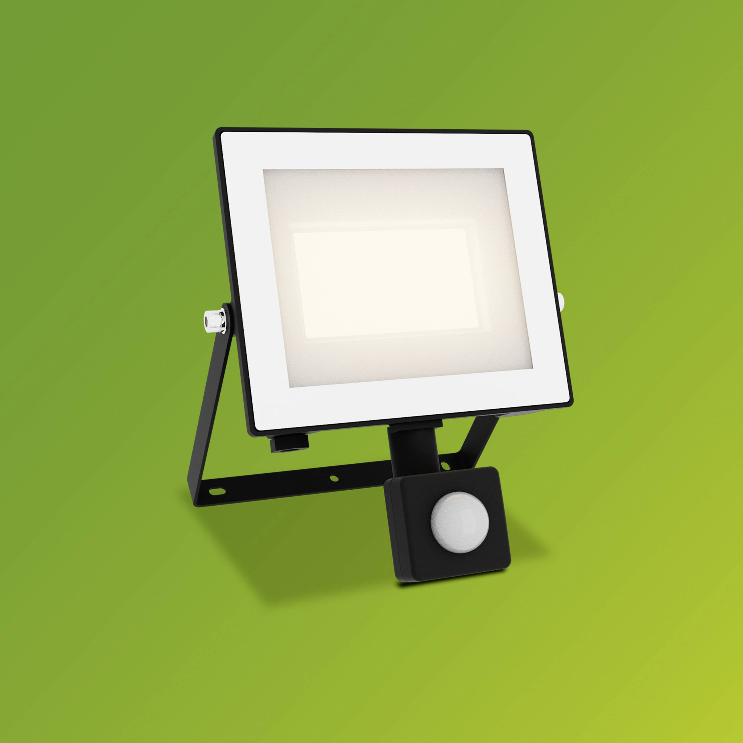 LED-Flutlicht mit Bewegungsmelder vor grünem Hintergrund, geeignet für Außenbeleuchtung.