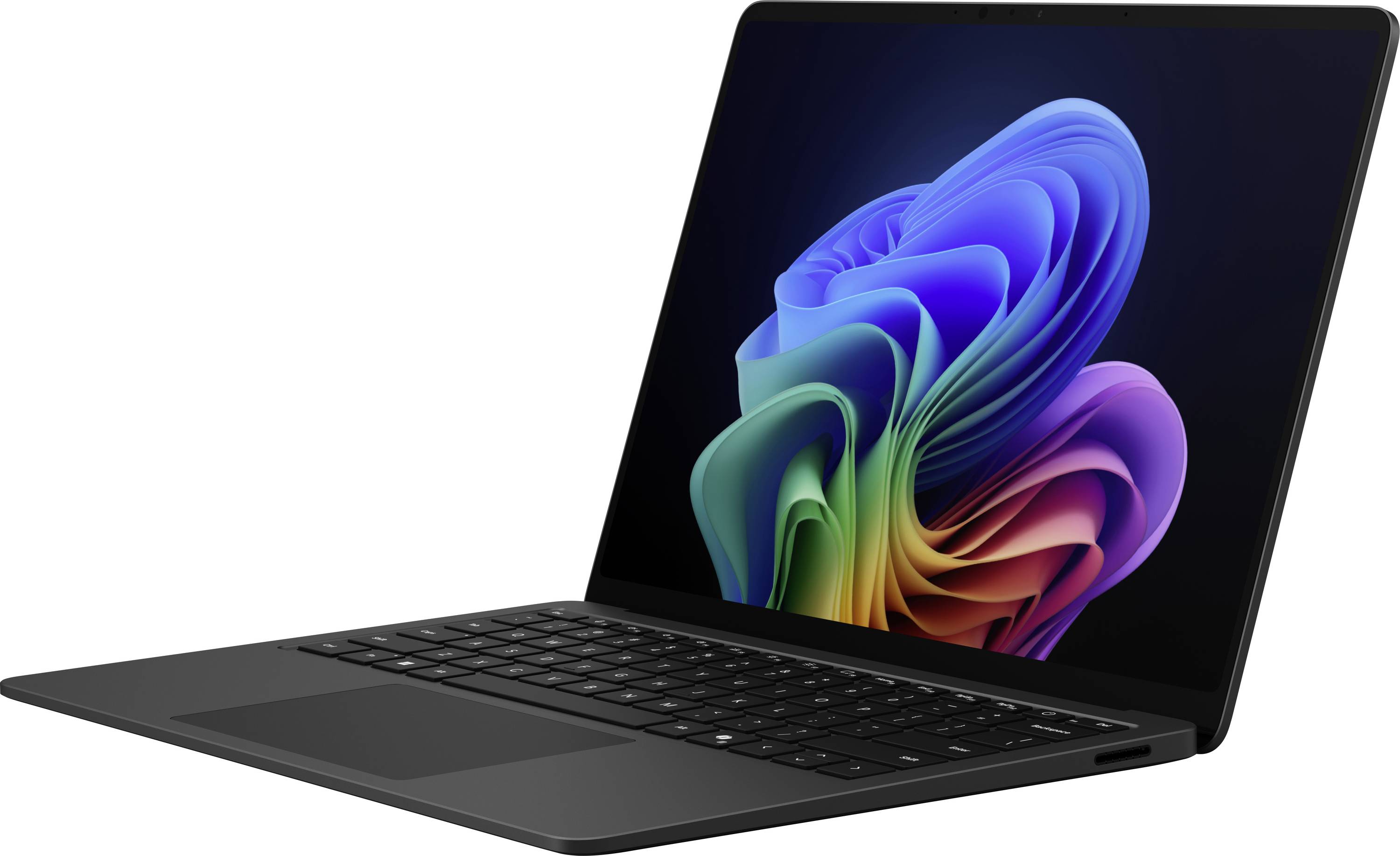 Ein schwarzer Laptop mit beleuchtetem Bildschirm zeigt ein abstraktes, buntes, spiralförmiges Muster auf dunklem Hintergrund.