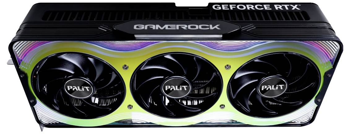 Grafikkarte von oben, drei Ventilatoren, Beschriftung 'GAMEROCK' und 'GEFORCE RTX' sichtbar. Schwarzes Gehäuse mit bunten Akzenten.