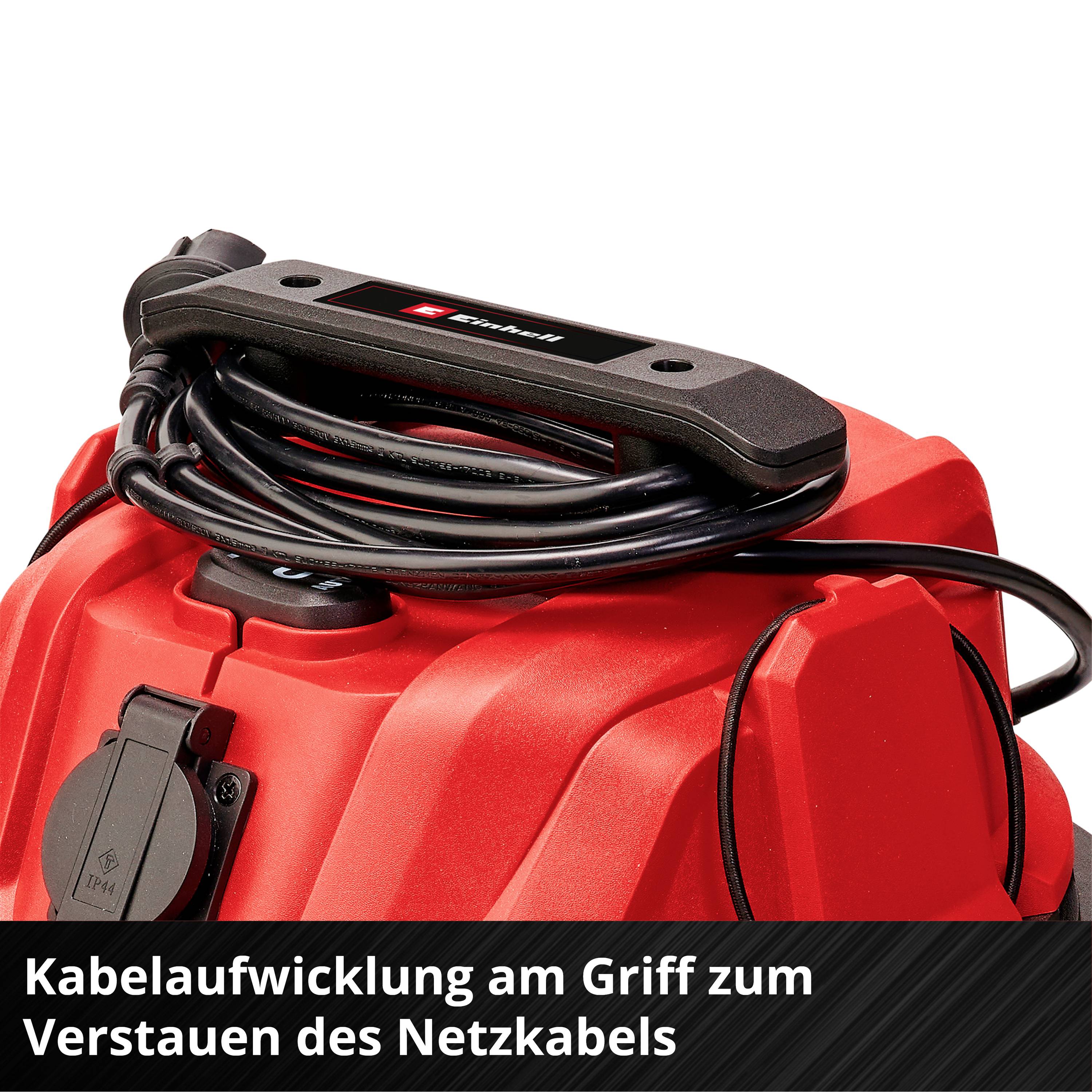 'Kabelaufwicklung am Griff zum Verstauen des Netzkabels.' Ein rotes Gerät mit zusammengerolltem Kabel am Griff für Platzersparnis.