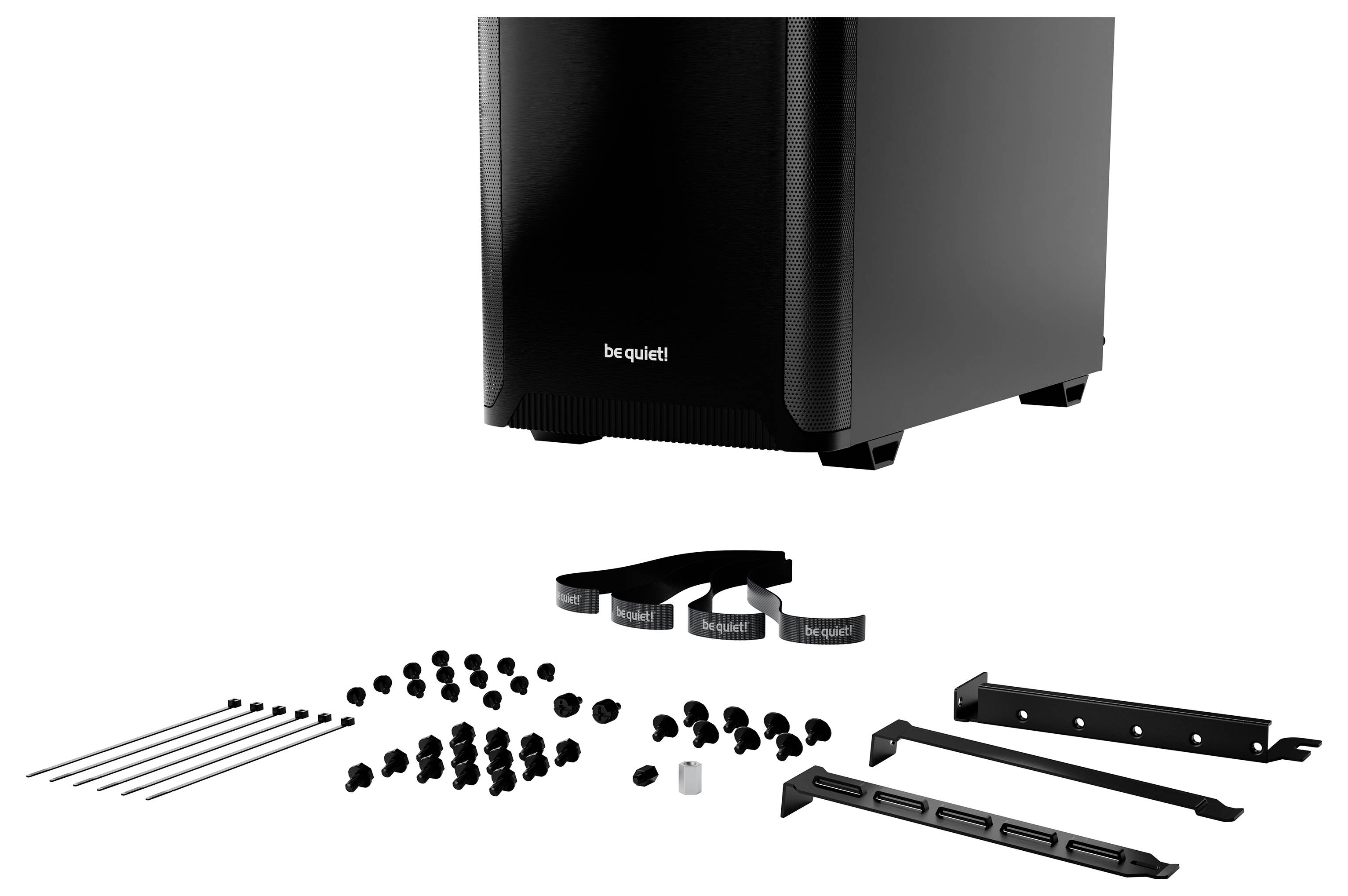 Ein schwarzes Computergehäuse von 'be quiet!' mit Zubehör wie Schrauben, Kabelbindern und Halterungen davor liegend.