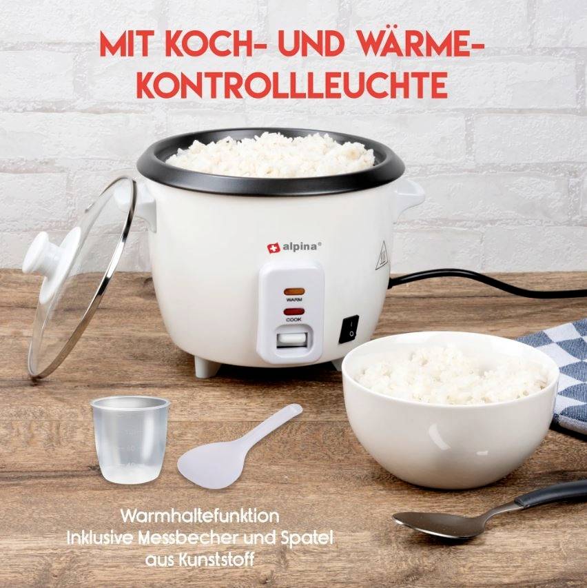 Reiskocher mit Schüssel voller Reis, einer Messbecher und Spatel. Aufschrift: 'Mit Koch- und Wärmekontrollleuchte'.