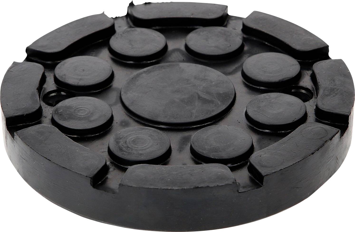 Ein schwarzes, rundes Gummipad mit mehreren erhöhten kreisförmigen Bereichen und Aussparungen am Rand, vermutlich zur Stabilisierung von Geräten.