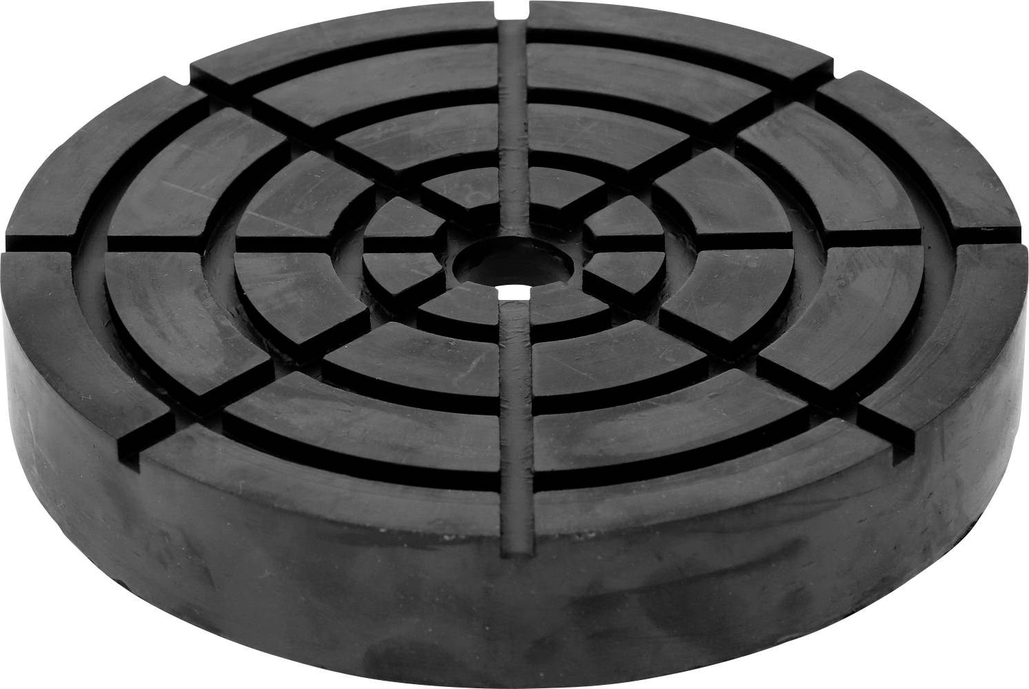 Runde, schwarze Gummischeibe mit Rillenmuster und zentriertem Loch. Wird oft als Dämpfer oder Schutzunterlage verwendet.