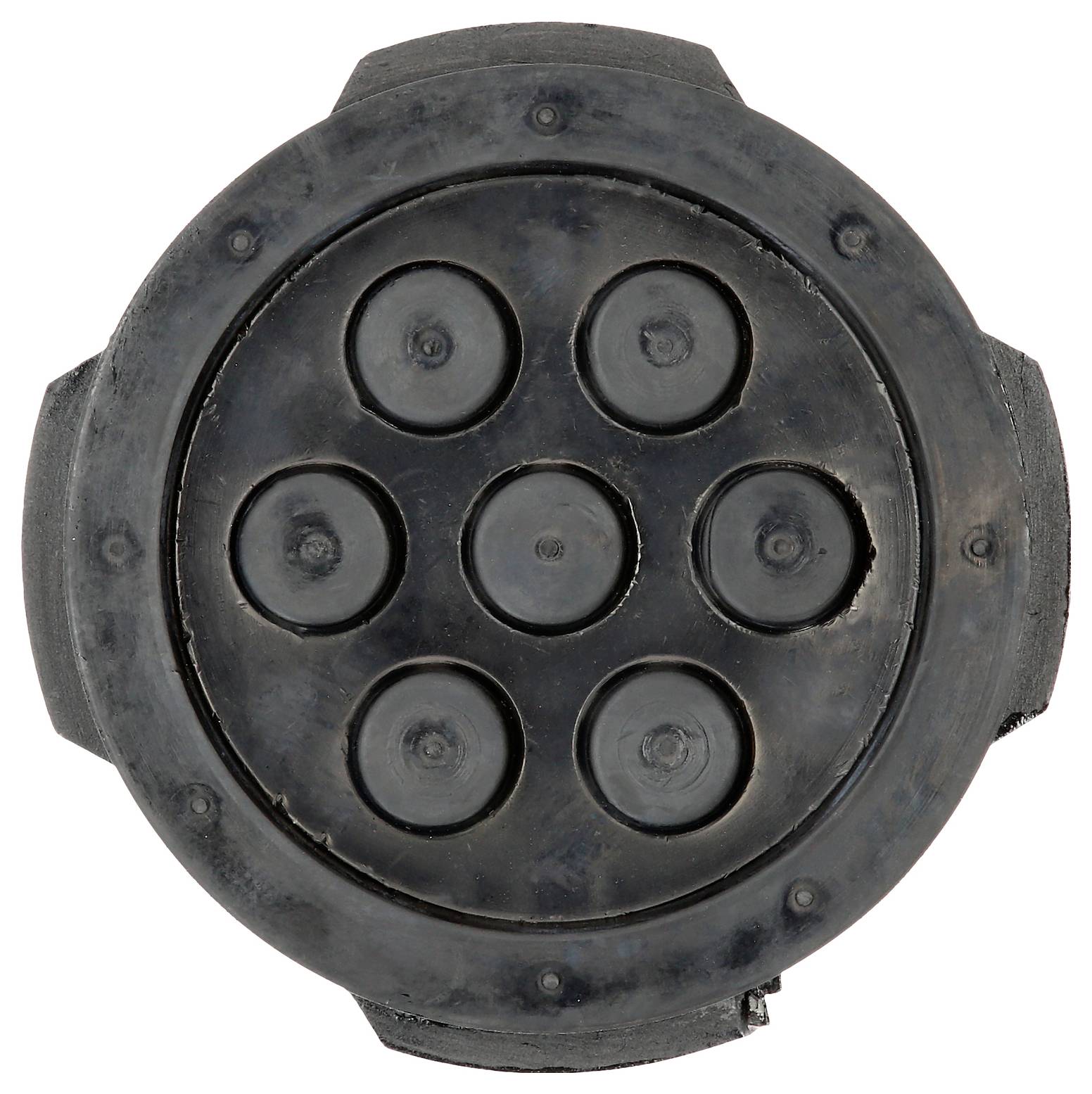 Eine schwarze runde Matte mit sieben erhabenen Kreisen, die wie ein Teil oder eine Komponente eines größeren Mechanismus aussieht.