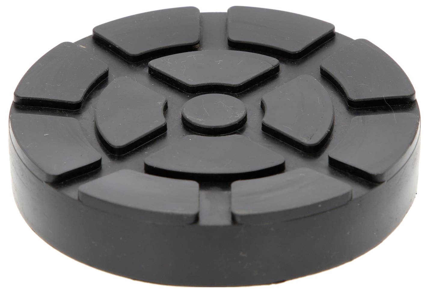 Schwarzer, runder Gummifuß mit gerillter Oberfläche, oft als Vibrationsdämpfer für Haushaltsgeräte genutzt.