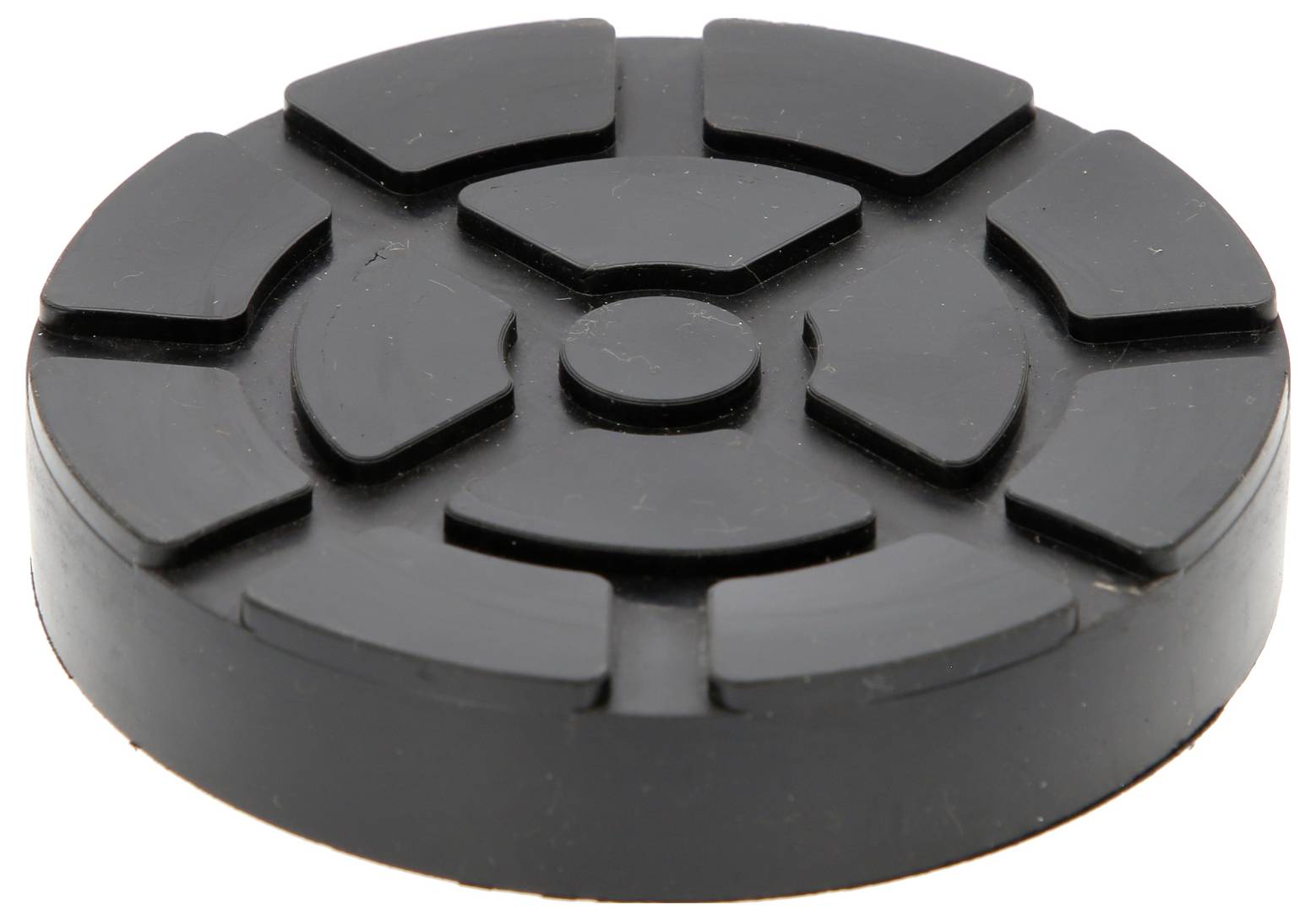 Schwarzer, runder Gummipuffer mit Rillen auf der Oberfläche. Verwendet zum Schutz oder als Stoßdämpfer unter Maschinen.