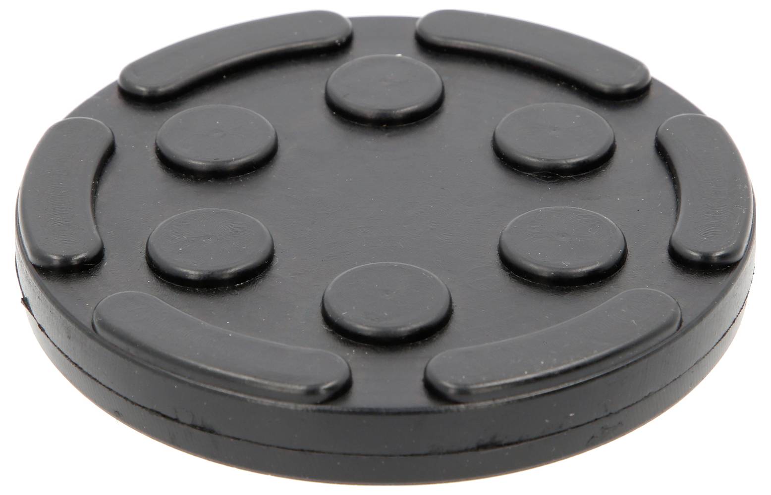 Schwarze runde Gummischeibe mit erhabenen, gleichmäßig verteilten Punkten und Linien auf der Oberfläche.