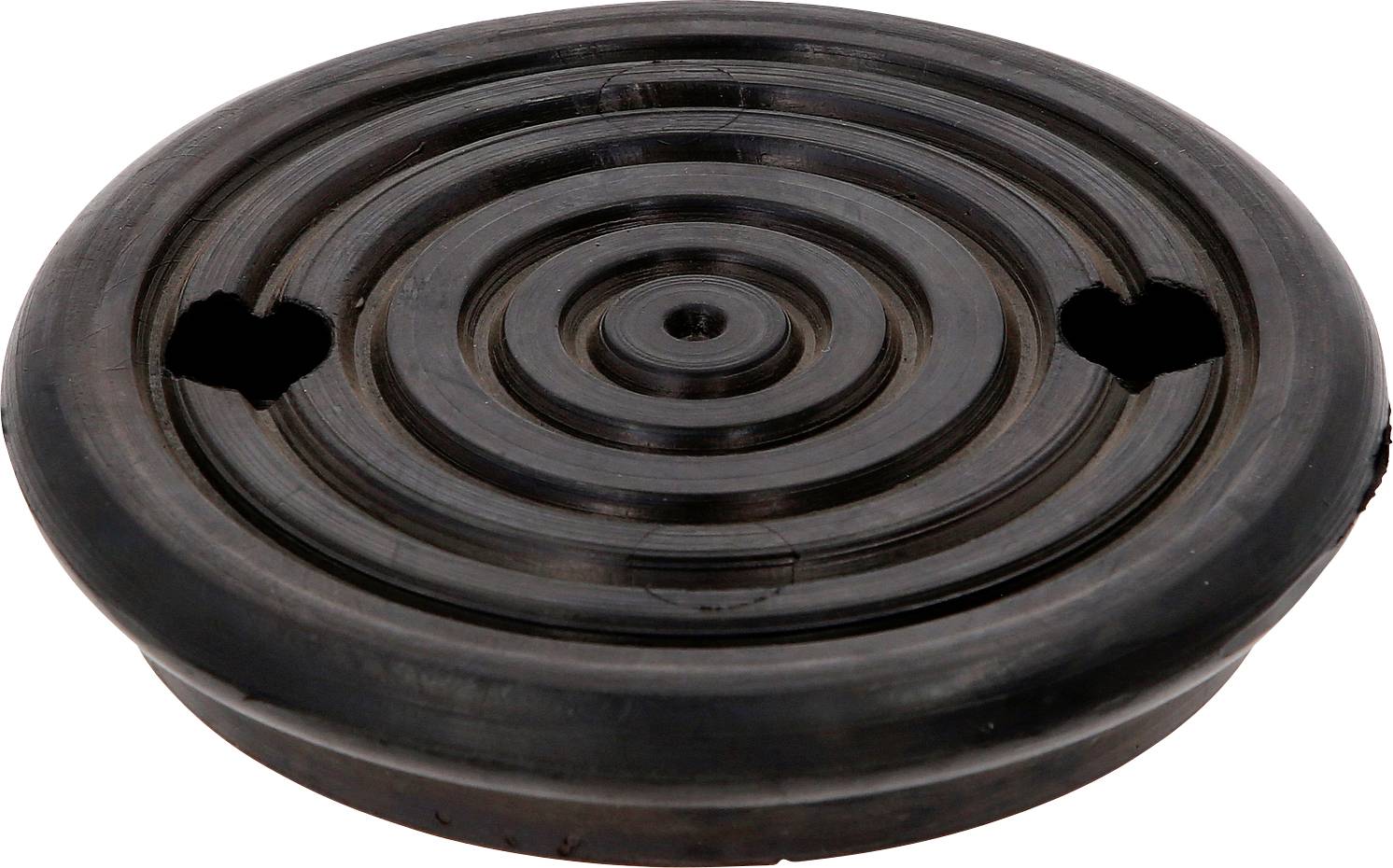 Ein brauner, runder Topfuntersetzer mit konzentrischen Kreisen und zwei Löchern am Rand.