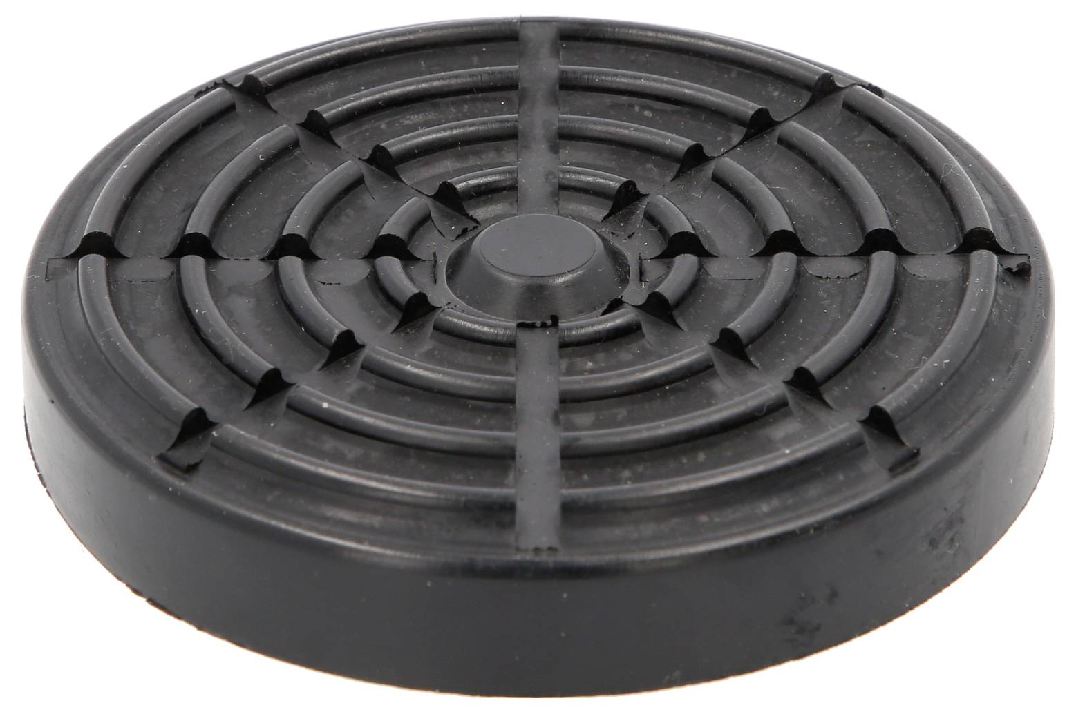 Ein runder, schwarzer Gummifuß mit kreisförmigem Rillenmuster, wahrscheinlich als rutschhemmende Unterlage oder zum Schutz von Oberflächen.
