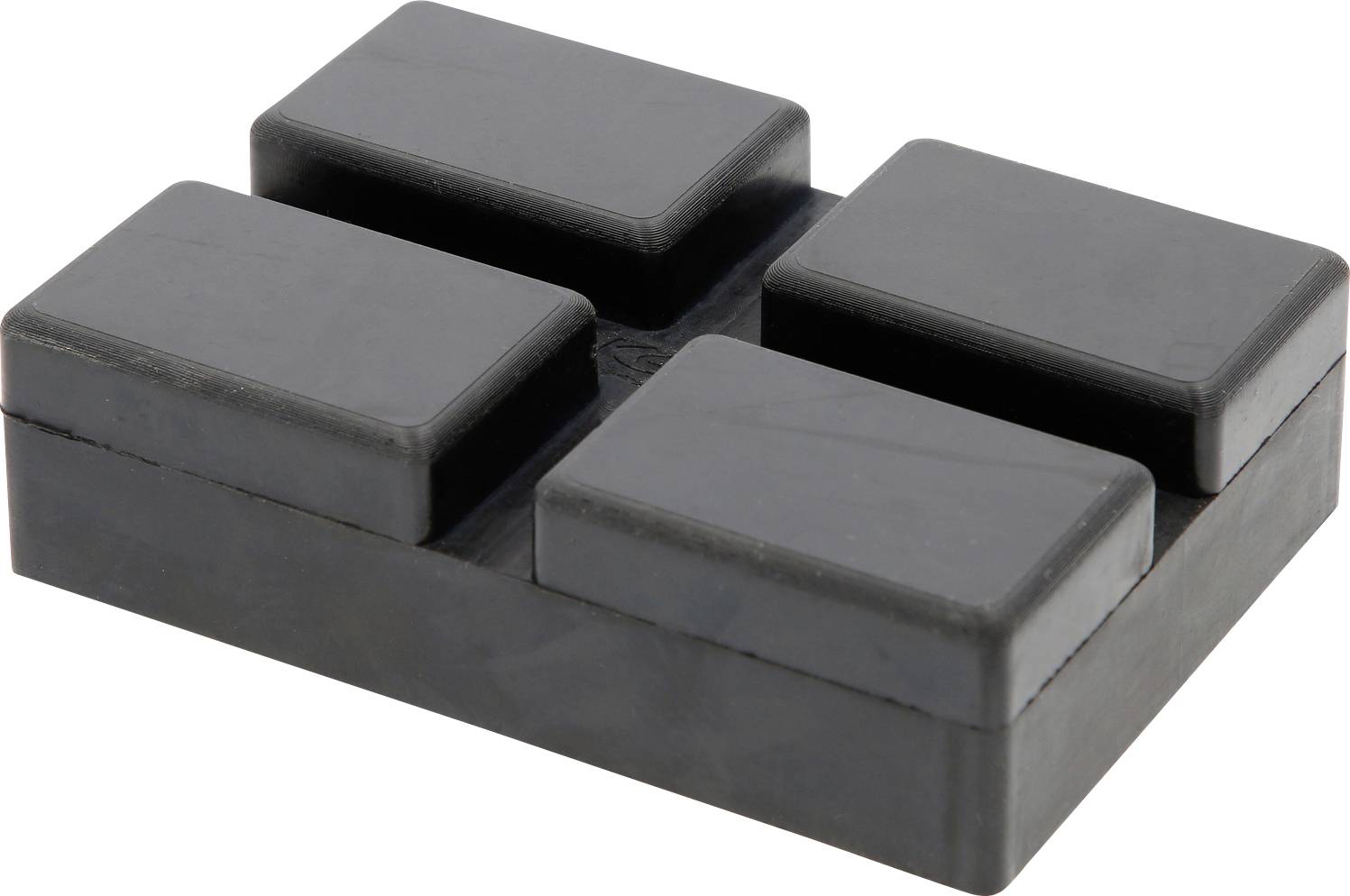 Ein schwarzer Gummiblock mit vier rechteckigen Erhebungen auf der Oberseite, oft als antivibrations- oder Dämpfungspad verwendet.