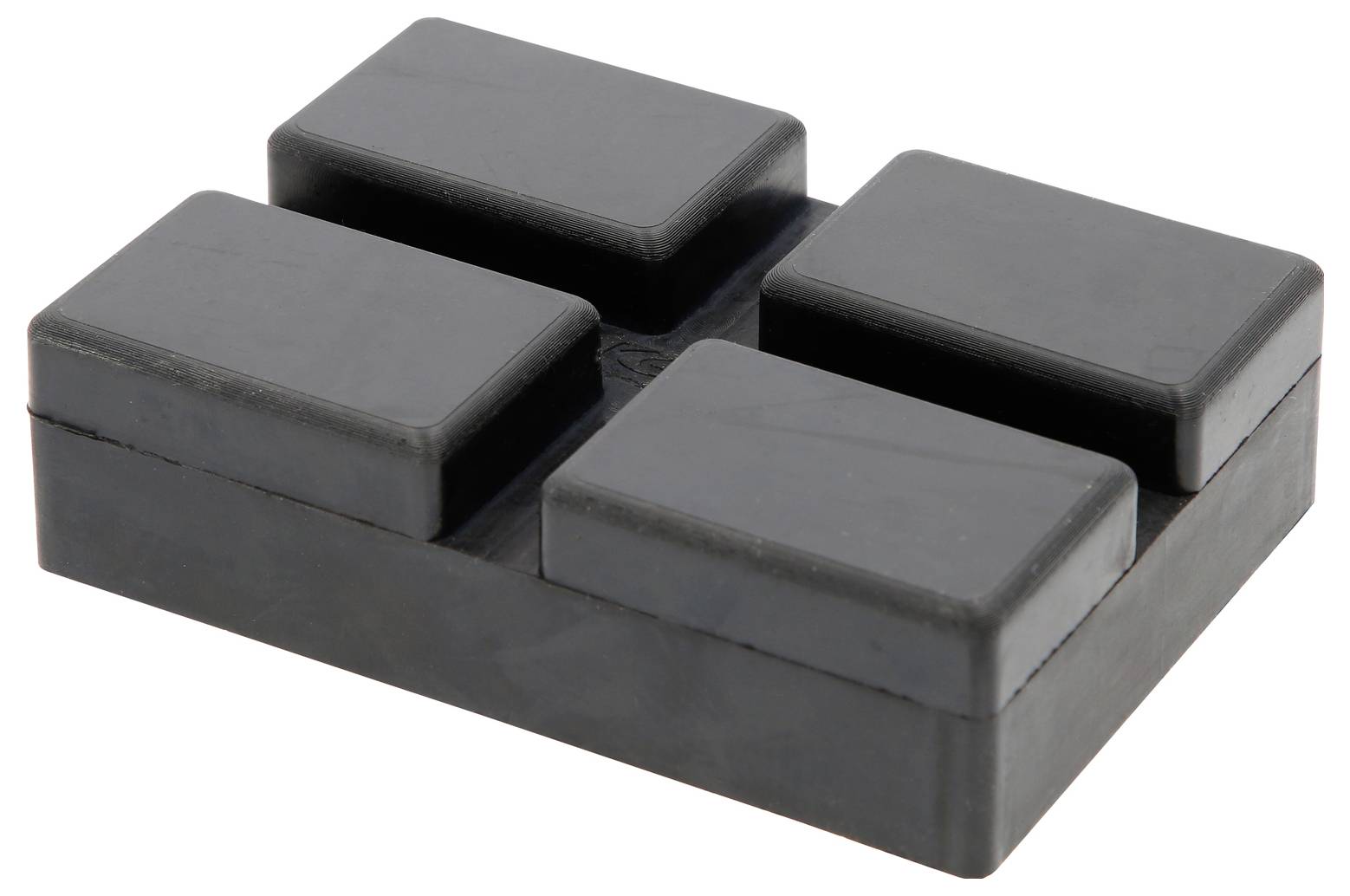 Vier rechteckige, schwarze Gummifußpolster, die als vibrationsdämpfende Unterlage für elektronische Geräte oder Möbel dienen.