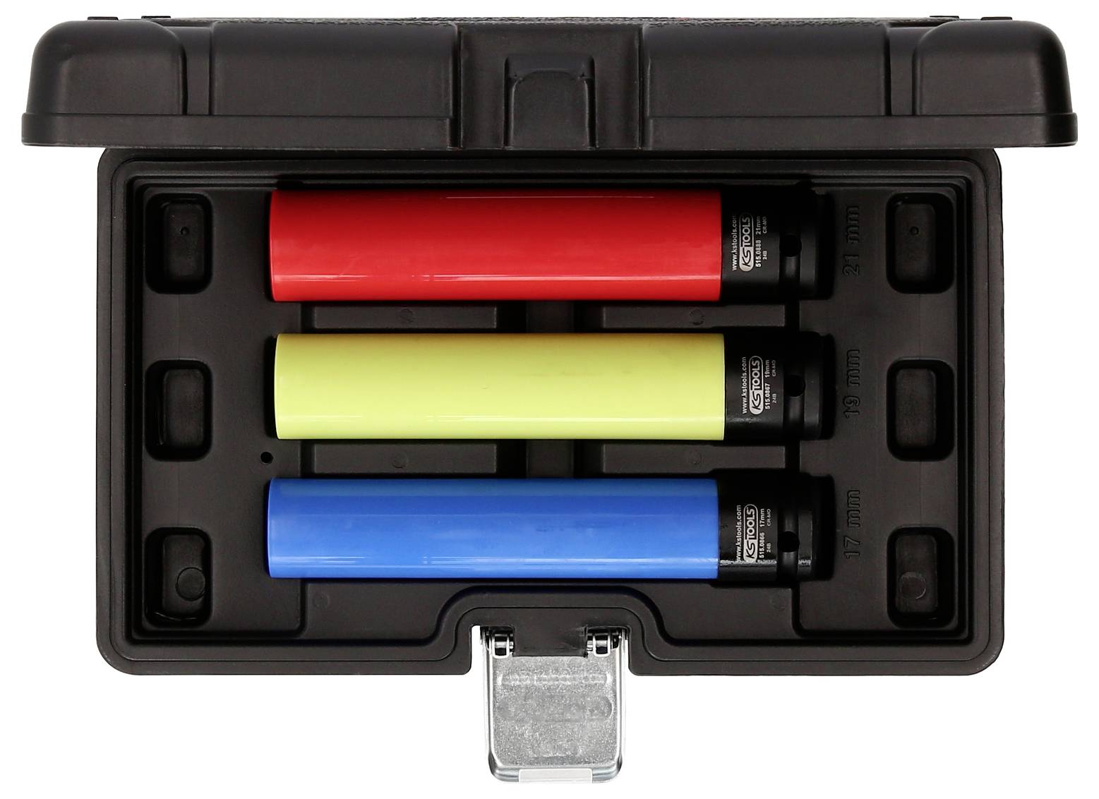 Drei farbige Zylinder in einer schwarzen Box: ein roter, ein gelber und ein blauer. Box geöffnet, zeigt symmetrische Anordnung.