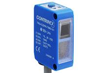 Ein blauer optischer Sensor mit der Aufschrift 'CONTRINEX'. Er hat eine rechteckige Form und ist für industrielle Anwendungen geeignet.