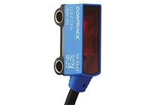 Ein blauer, rechteckiger Sensor mit rotem Sichtfenster von 'Contrinex', Modell LRG-127A, mit Kabelanschluss unten, zur Objekterkennung.