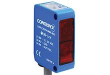Ein blauer Optosensor mit rotem Lichtfenster, Markenname 'CONTRINEX' auf der Vorderseite. Wird zur Objekterkennung verwendet.