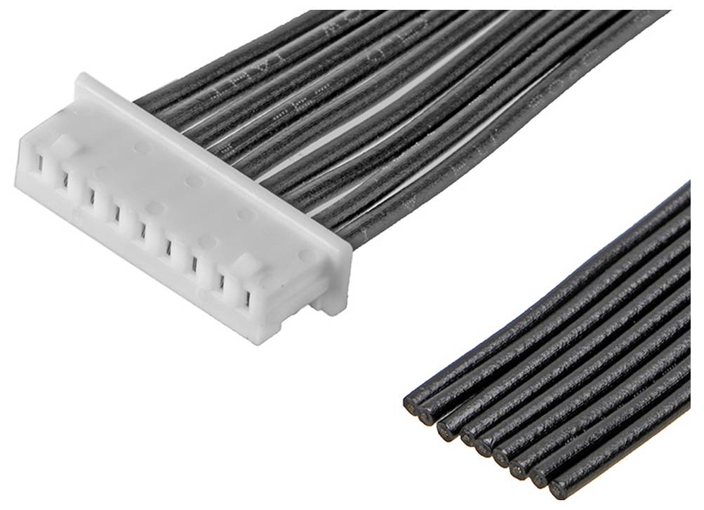 Nahaufnahme eines weißen Steckverbinders mit mehreren schwarzen Drähten, die sich nach rechts erstrecken. Detail eines elektronischen Bauteils.