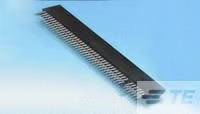 Ein elektronisches Bauteil mit vielen Pins auf einem blauen Hintergrund. Es scheint sich um einen IC oder Steckverbinder zu handeln.