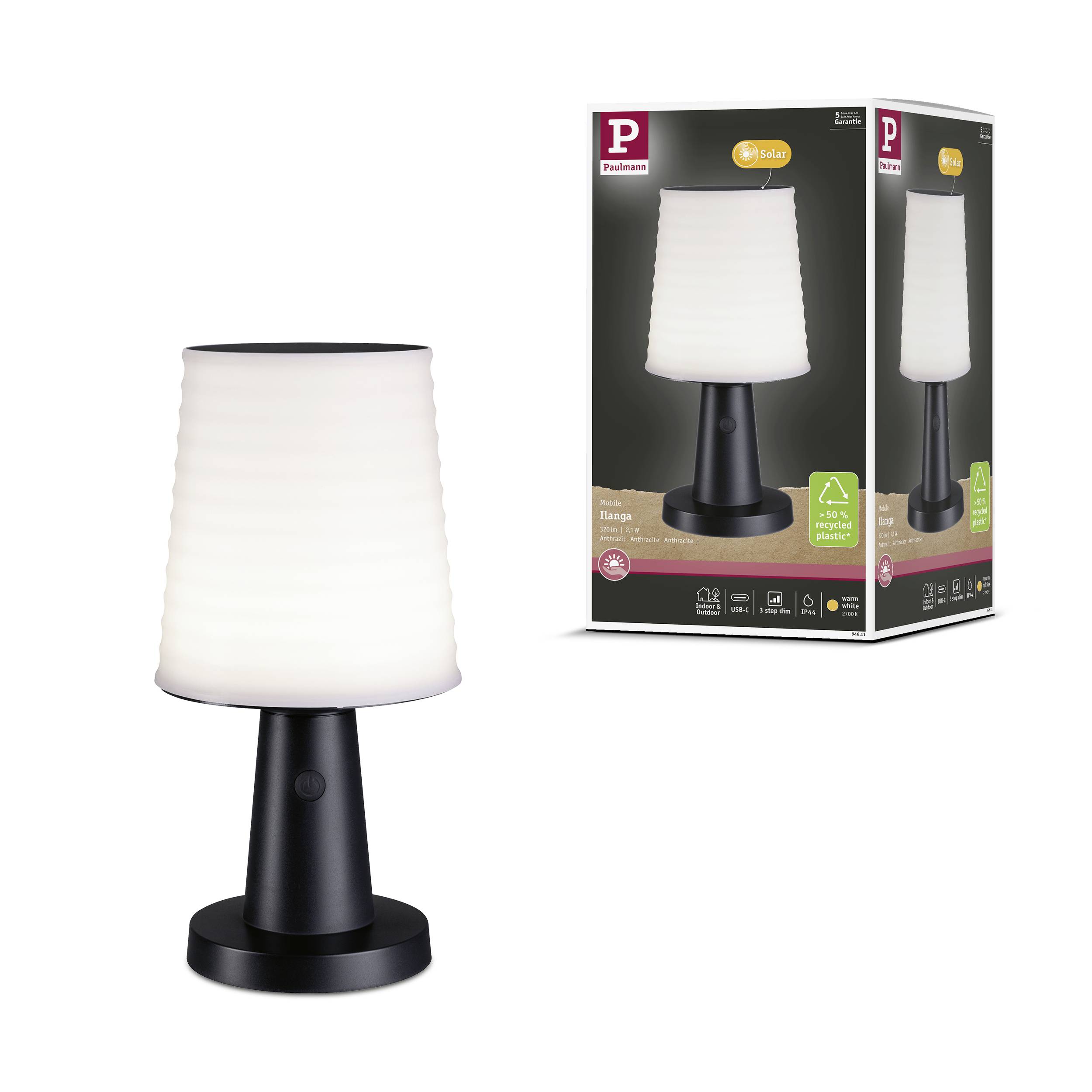 Tischlampe mit weißem Schirm und schwarzem Sockel, daneben die Verpackung mit gleichem Bild und Produktbeschreibung.