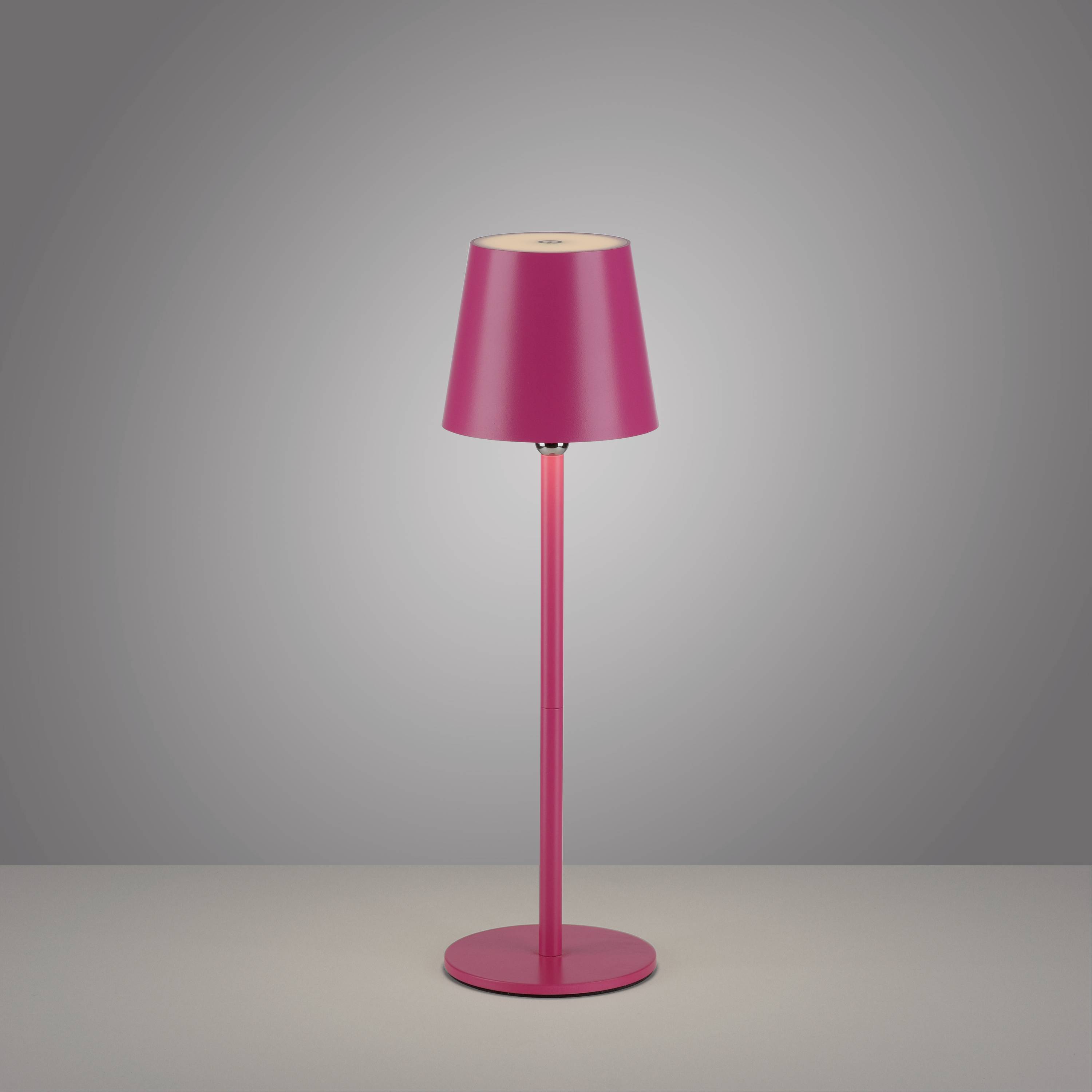 Rosa Tischlampe vor grauem Hintergrund; schlichtes, modernes Design mit zylindrischem Schirm und geradem Ständer.