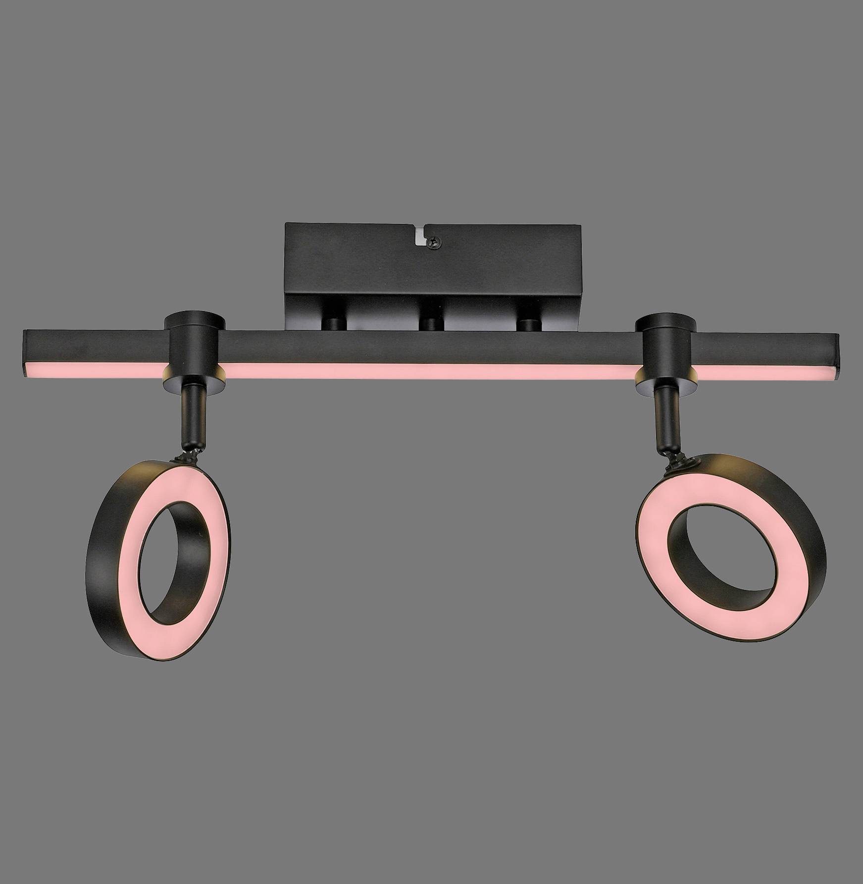 Zwei schwarze, kreisförmige LED-Leuchten an einer schwenkbaren Halterung, mit rosa Lichtschein, auf grauem Hintergrund.