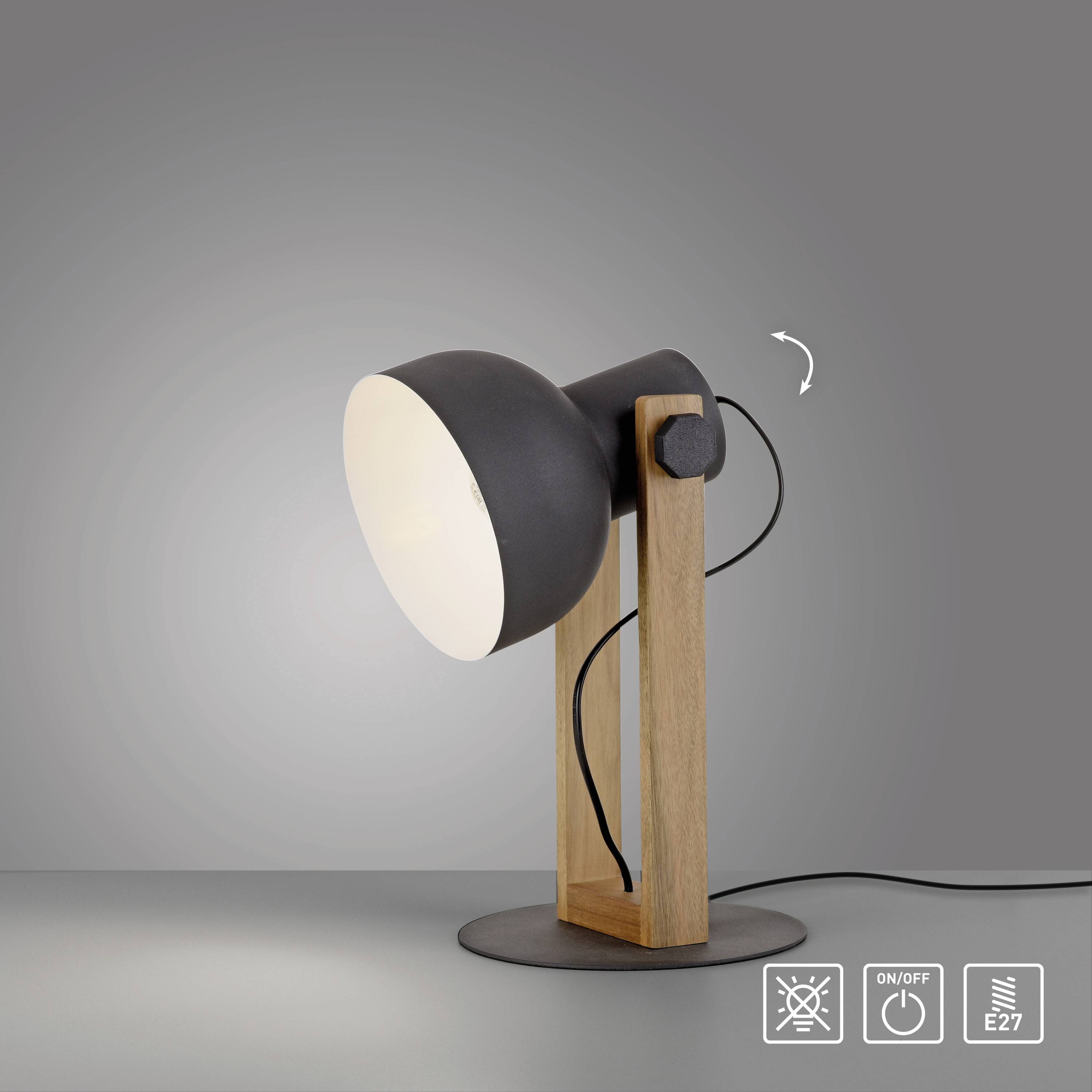 Eine schwarze Tischlampe mit Holzgestell leuchtet nach rechts. Unten sind Symbole für 'An/Aus'-Schalter und E27-Lampenfassung.
