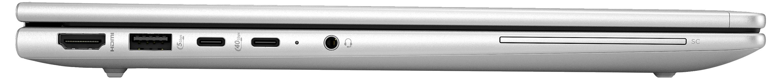 Ein geschlossenes silbernes Laptop von der Seite, zeigt Anschlüsse: HDMI, USB, USB-C, Kopfhörerbuchse und SD-Kartensteckplatz.